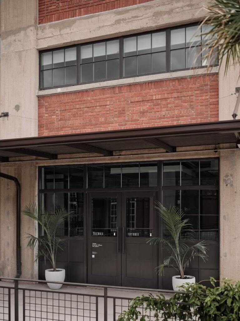 Modern building entrance with potted plants