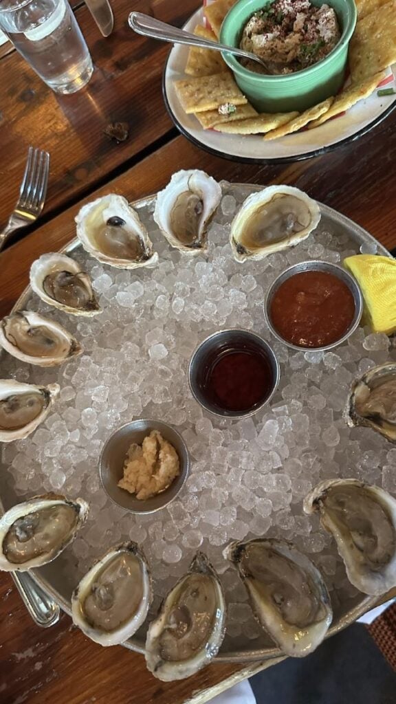 Oysters on ice with cocktail sauce and horseradish.