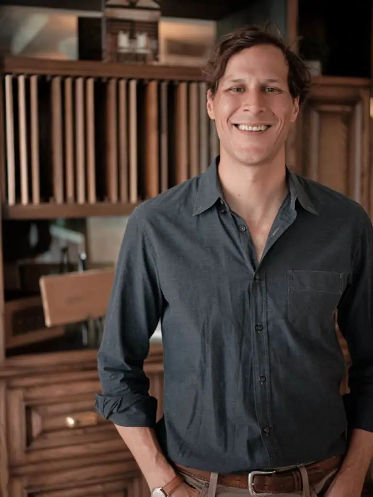 Smiling person in casual clothing indoors