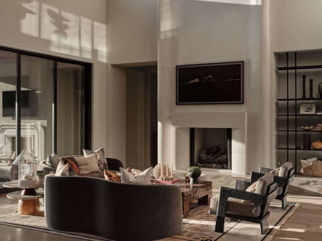 Modern living room with fireplace and stylish furniture.