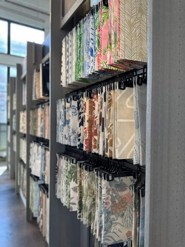 Colorful wallpaper samples displayed in store.