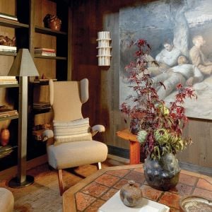 Cozy room with art, chair, and plants