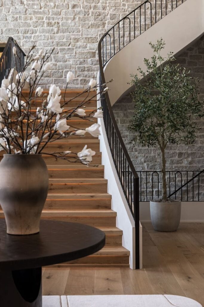 Modern staircase with stone wall and wooden steps