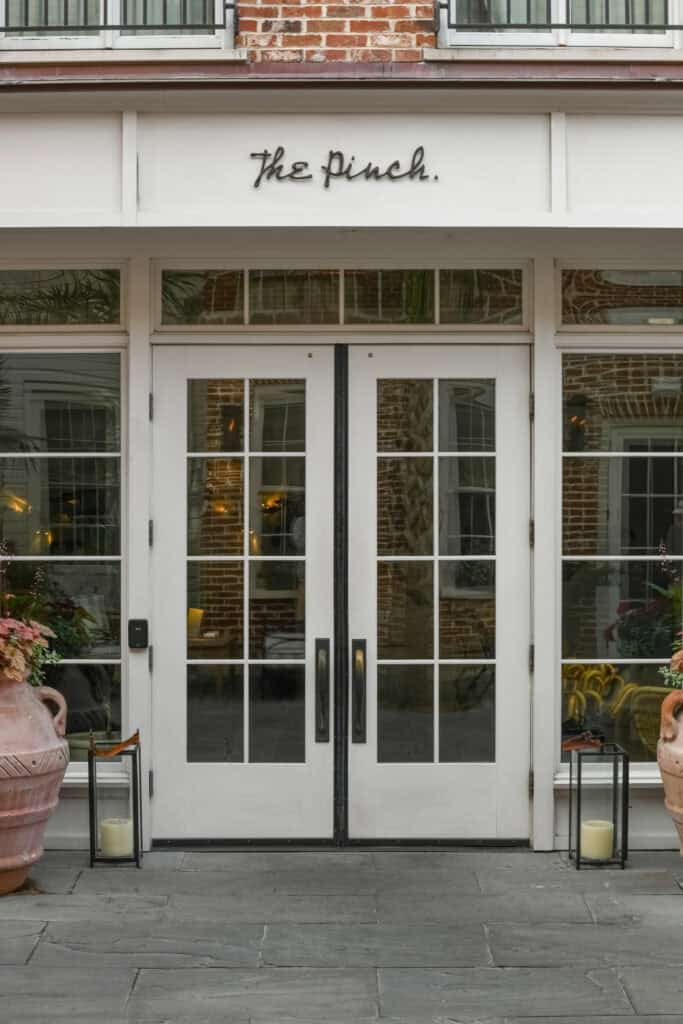 Entrance of The Finch with white double doors