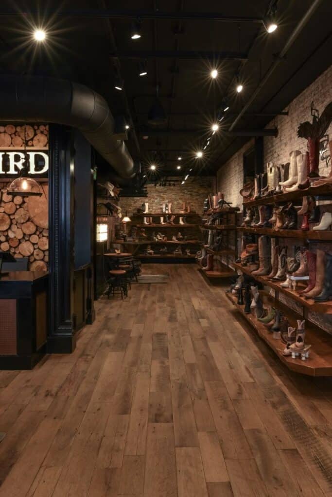 Rustic boot store interior with wooden shelves