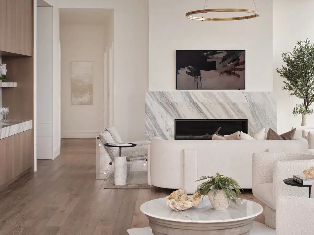 Modern living room with marble fireplace and neutral decor